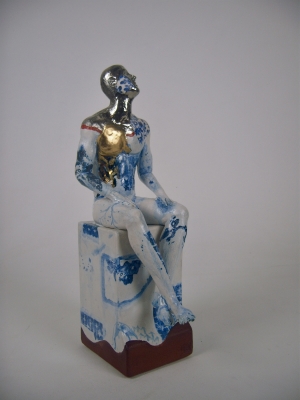 Seated male nude on plinth