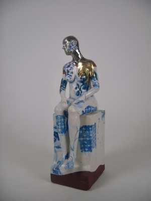 Seated female nude on plinth 2