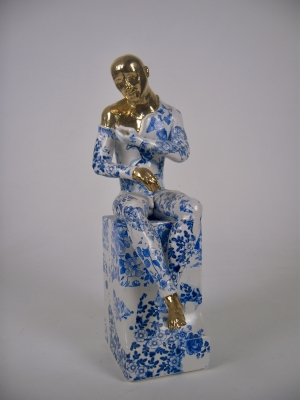 Seated male nude on plinth (precious series)