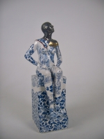 Seated female nude on plinth 1